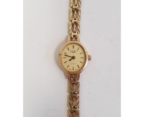 Lady's 9ct gold Rotary wristwatch, the oval dial with baton numerals and side button and the 9ct gold rectangular chain link 