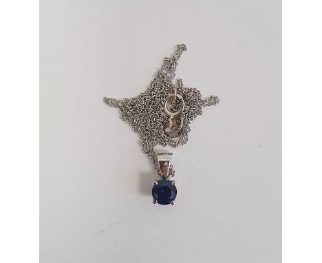 18K white gold and sapphire pendant set single circular stone and the 18K white gold fine chain link necklace 