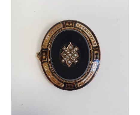 Victorian gold-coloured metal, black onyx, enamel and seedpearl mourning brooch, oval set with central seedpearls to the onyx