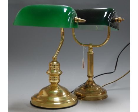A lacquered brass desk lamp, having adjustable green glass shade, h.38cm; together with one other similar example (2)
