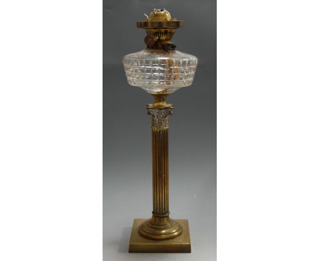 An early 20th century oil lamp, having cut clear glass reservoir on Corinthian column and square base, h.52cm