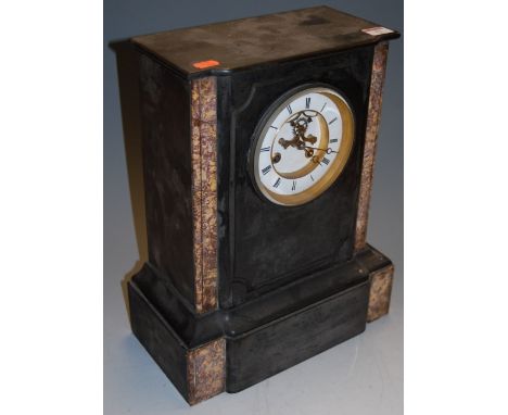 A late Victorian black slate and rouge marble cased mantel clock having an enamel dial with Roman numerals and visible lever 