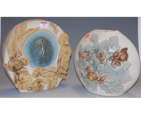 A Bernard Rooke studio pottery mantel clock, having quartz movement, bearing paper label verso, h.29cm; together with a Berna