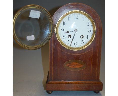 An Edwardian mahogany and satinwood inlaid cased mantel clock, having enamelled dial with Arabic numerals and eight day movem