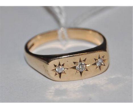 the three small gypsy set diamonds, with tapered band hallmarked for 9ct gold, Birmingham 1990, size R, (4.6g)