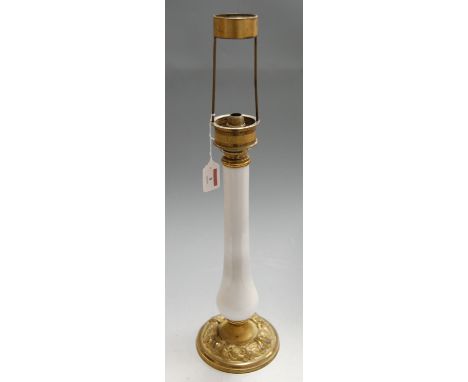 An early 20th century table lamp base, having brass fittings to slender milk glass column, on embossed brass base, h.56cm (in