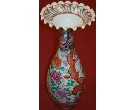 A large Japanese late Meiji period floor vase having a wavy rim of mid baluster form enamel decorated with figure scene amids