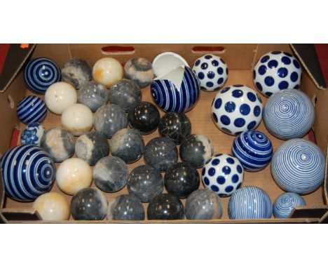 A box of miscellaneous polished hardstone indoor boules; togteher with various modern ceramic examples