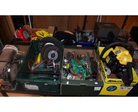 A quantity of assorted tools and equipment including a belt sander, a vintage fire alarm, a vintage metal first aid box, etc.