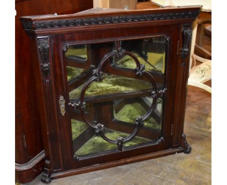 A 19th century mahogany flat fronted hanging corner cabinet, the single glazed door enclosing mirrored back panel and single 