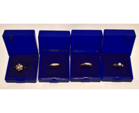 Four 18ct yellow gold dress rings including an example with oval shaped mount set with five diamonds, size Q, combined approx