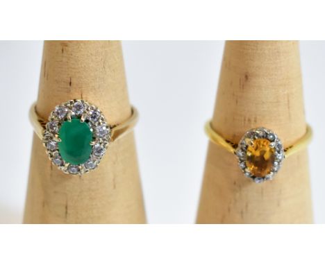 An 18ct yellow gold dress ring set with central emerald coloured stone, flanked by melee of white stones, size O 1/2, and a f