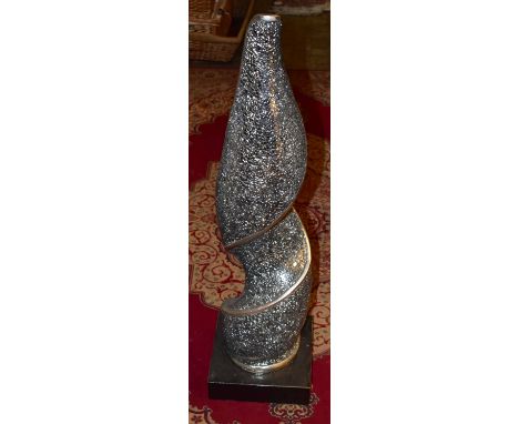 A contemporary sculpture with silvered and broken glass effect on a composite plinth base, height 95cm.Additional Information