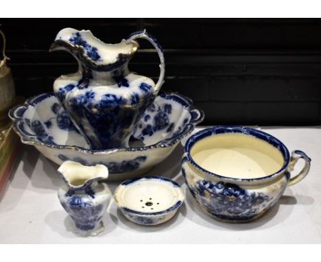 T RATHBONE &amp; CO; an early 20th century five piece blue and white toilet set comprising jug, bowl, chamber pot, vase and s