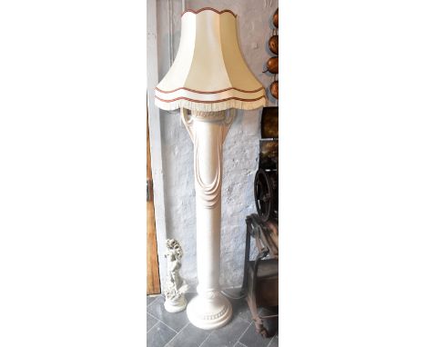 A modern decorative Italian style standard lamp with moulded decoration, height 154cm.