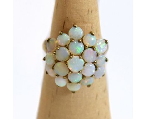 A 14ct yellow gold mounted opal floral cluster ring, size J, approx 3.1g.Additional InformationLight wear to the band and opa