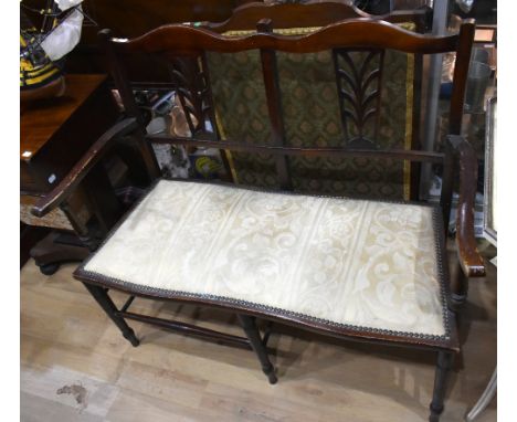 An Edwardian beech two seater settee with pierced splat backs on turned column supports, width 100cm, height 90cm, depth 47cm