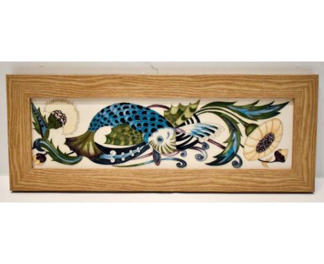 NICOLA SLANEY FOR MOORCROFT; a contemporary wall plaque decorated in the 'Fishing for Dreams' pattern, in a light oak effect 