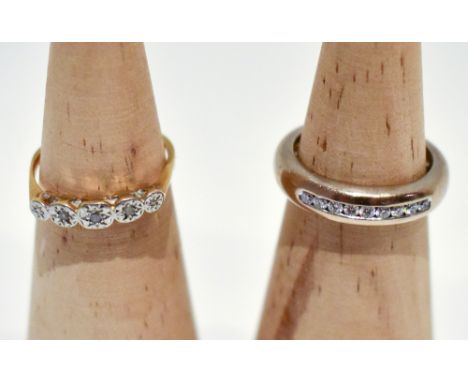 An 18ct yellow gold and platinum illusion set five stone dress ring, size J 1/2, and a white metal ring set with nine clear s