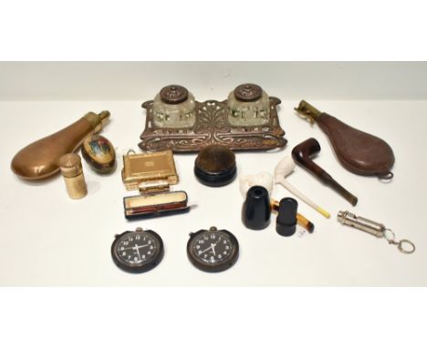 An assortment of collectors' items including two Smiths stop watches, an Art &amp; Crafts style cast metal desk stand, two po