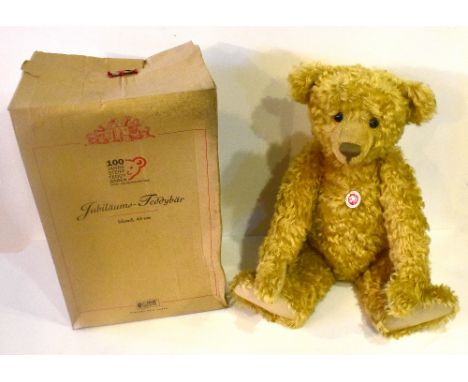 STEIFF; a boxed 100 Jahre plush bear.Additional InformationThe box is tired, minor tears to the box, water damage. The bear i