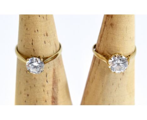 Two 9ct yellow gold solitaire dress rings, each set with clear stones, size M 1/2 and K (2).Additional InformationWe believe 