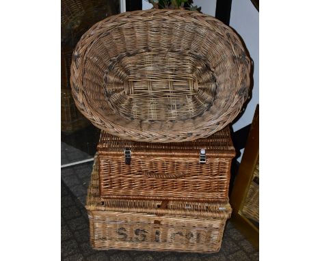 Two wicker picnic baskets (lacking contents), a wicker laundry basket and a wicker planter, containing a faux tree.