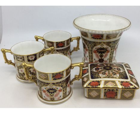 A collection of Royal Crown Derby Imari ware to include: a tapering jardiniere pattern 1128 (XXXVII); three loving cups - 2 x