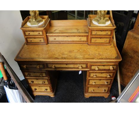 A Victorian oak and pollard inlay pedestal writing desk, circa 1870, a two higher section with an oak gallery above two short