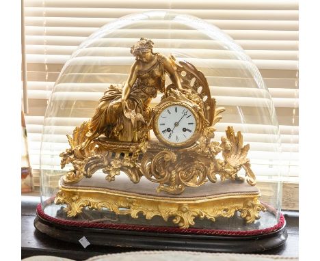 ****** ITEM LOCATION BISHTON HALL**********A French ormolu figural mantel clock on stand with glass dome, surmounted by a fem