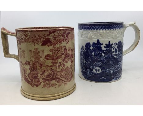 A 19th Century Staffordshire blue and white transfer printed large mug decorated with pastoral scent of figures in landscape 