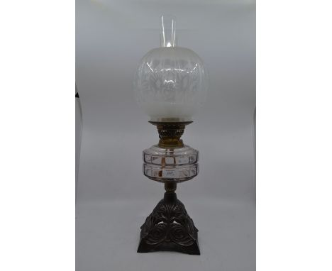 ****** ITEM LOCATION BISHTON HALL**********A late Victorian oil lamp with metal base, glass globe and clear paraffin body