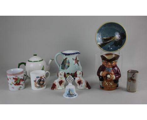 A Royal Doulton Toby jug 'Toby XX' 17.5cm high, a pair of miniature Staffordshire pottery spaniels 9cm high, and a ceramic te