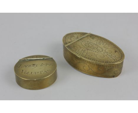 A 19th century circular brass snuff box the hinged lid inscribed 'JP Labor Ispe Voluptas' 5.8cm diameter, together with an ov