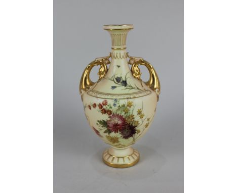 A Royal Worcester blush ivory porcelain two-handled vase, decorated with flowers, with gilt embellishments, shape number 1683