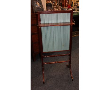 A Victorian mahogany framed fire screen with pleated silk sliding panel and fold down shelf, 44cm