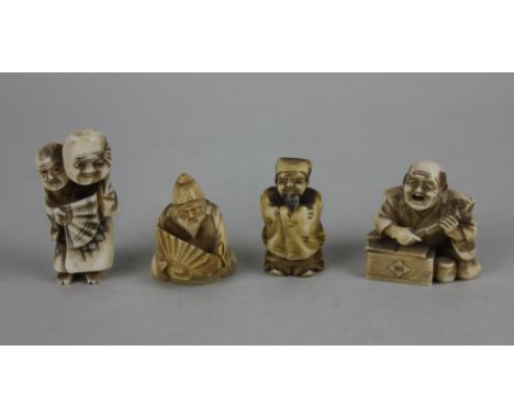 Four Japanese netsuke of men in various poses, one signed, four with fans, tallest holding a mask 4.5cm high