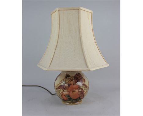 A Moorcroft pottery baluster table lamp decorated with sparrows, apricots and grapes, in orange tones, 17cm high excluding fi