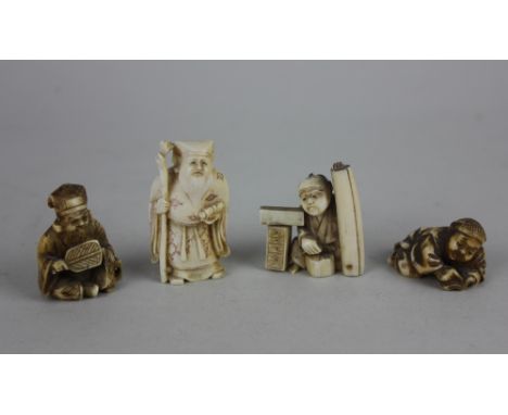 Four Japanese netsuke of men in various poses, one holding a staff, three signed, largest 4.5cm high