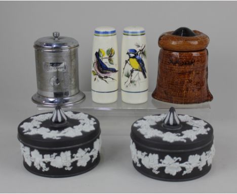 A pair of Wedgwood black Jasperware pots and covers decorated with fruiting vines, a ceramic salt and and pepper decorated wi