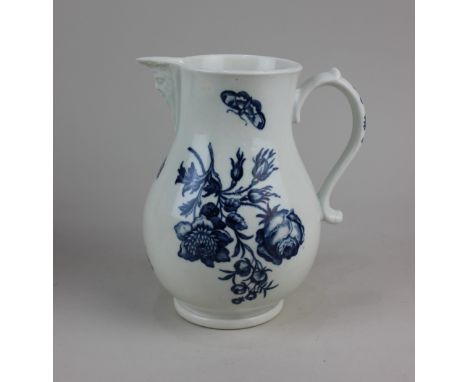 A Worcester porcelain 'Bouquets' pattern blue and white jug, with bearded mask spout, decorated with flowers and butterflies,