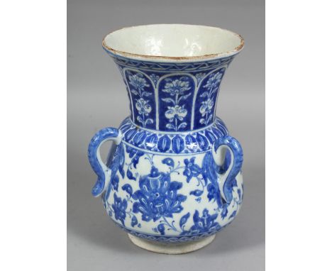 A TURKISH KUTAHYA BLUE AND WHITE POTTERY MOSQUE LAMP, painted with floral decoration, the body with three handles, 22.5cm hig