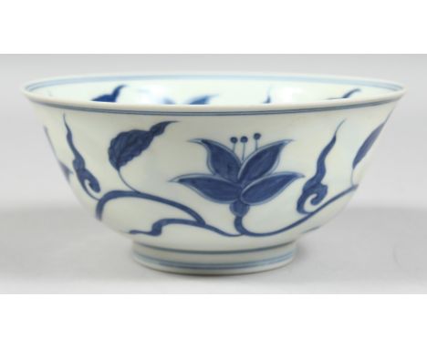 A CHINESE BLUE AND WHITE PORCELAIN BOWL, the interior and exterior painted with flora, the base with Chenghua mark. 15.5cm di