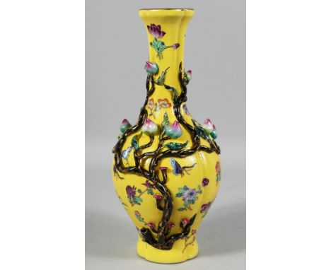 A CHINESE YELLOW GROUND FAMILLE ROSE PORCELAIN VASE decorated in relief with peach blossom, the body with painted butterflies