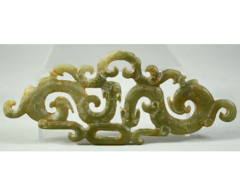A LARGE CHINESE CARVED AND PIERCED JADE AMULET, with chilong motifs, 15cm long.