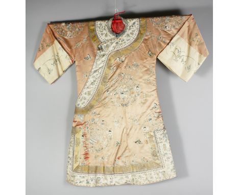 A 20TH CENTURY CHINESE EMBROIDERED SILK ROBE, finely embroidered with native flora, butterflies and birds, the reverse in ful