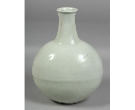 A CHINESE WHITE GLAZED PORCELAIN MOON FLASK, with incised floral decoration, with four-character mark below the neck. 32cm hi