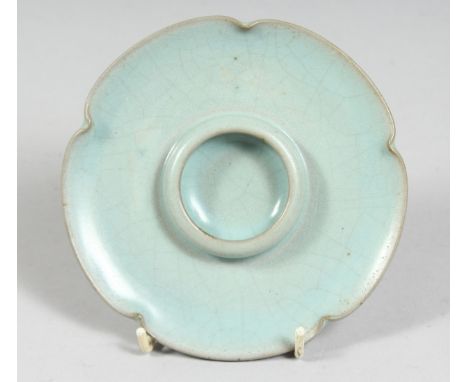 A CHINESE CELADON PORCELAIN CUP STAND in the Ru-ware style. 13cm diameter