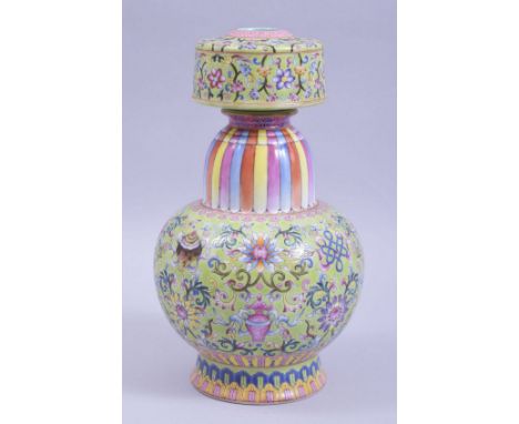 A CHINESE FAMILLE ROSE PORCELAIN CANDLESTICK / VASE, the body with lime green ground with lotus and precious object, rainbow 