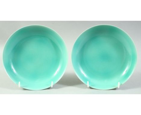 A PAIR OF CHINESE TURQUOISE GLAZE PORCELAIN DISHES, the base of each with six character mark, 17cm diameter.